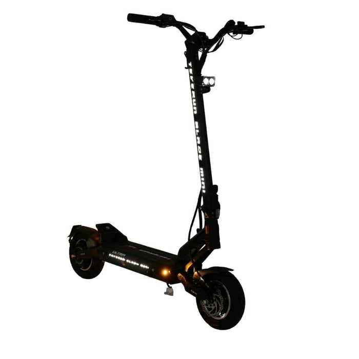 Black - front suspension system and rugged tubeless tire designed for smooth terrain handling and maximum stability.